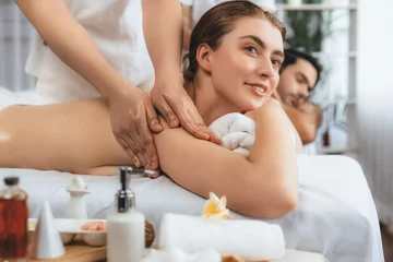 Poster Caucasian couple customer enjoying relaxing anti-stress spa massage and pampering with beauty skin recreation leisure in day light ambient salon spa at luxury resort or hotel. Quiescent © Summit Art Creations