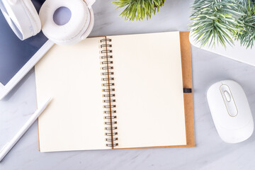 2024 goals and plans background. Blank notebook with laptop, pen, christmas tree background, on...