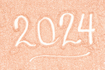 Festive background of blurred glitter of Christmas holiday sparkles in peach hue, color of the year...