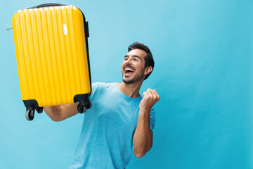 Baggage man traveler flight studio background travel happy yellow suitcase journey trip vacation