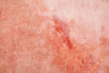 Grunge background texture of old rustic wall covered with pink paint