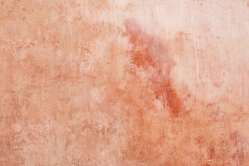 Texture of old rustic wall covered with pink stucco. Abstract background for design
