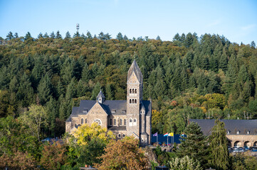 Obraz premium Views of Clervaux commune with town status in northern Luxembourg, capital of canton of Clervaux, abbey on sunset