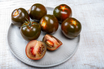 Fresh ripe sweet reddish brown and green kumato tomatoes