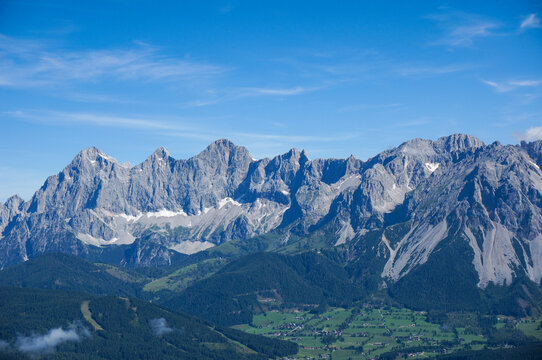 Amazing view to Dachstein mountain range in Styria near Ramsau Schladming on a sunny day with a clear blue sky and copy space for text