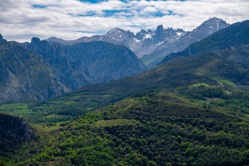 Fototapeta premium Panoramic view on Naranjo de Bulnes or Picu Urriellu, limestone peak dating from Paleozoic Era, located in Macizo Central region of Picos de Europa, mountain range in Asturias, North Spain