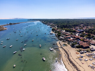 Aerial view, Arcachon Bay, fisherman's boats and oysters farms near Le Phare du Cap Ferret, France,...
