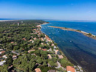 View on Arcachon Bay with many fisherman's boats and oysters farms near Le Phare du Cap Ferret and...