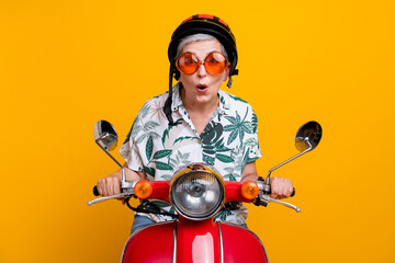 Photo portrait of lovely grandma helmet travel ride shock moped dressed stylish tropical print...