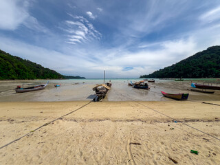 Kho Surin Island Coral reef teaming with reef fish of various colours. the Andaman Sea in  Thailand teaming beautiful lush green mountains and turquoise blue waters white sandy beaches