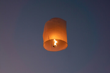 Thai people release sky floating lanterns or lamp to worship Buddha's relics at night. Traditional festival in Chiang mai, Thailand. Loy krathong