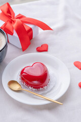 heart shaped glazed valentine cake in bed