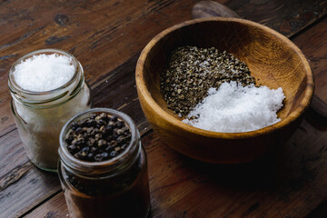 mixing coarse salt and coarse pepper for food seasoning