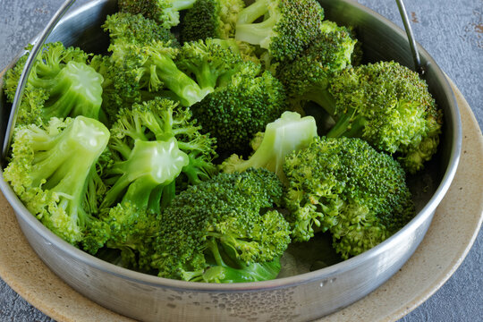 Steamed broccoli florets vegetable. Healthy homemade cooking.