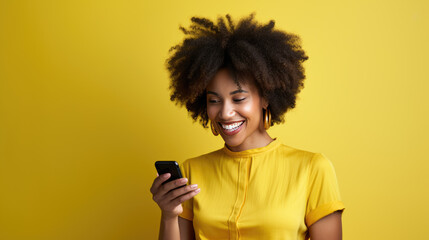 Young woman smiling and holding her smartphone on a colored background - Powered by Adobe