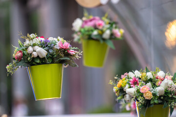 Pots of flowers hang in the air