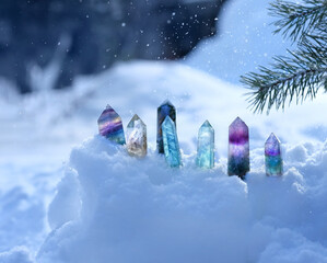 Crystals gemstones in snow close up, winter nature background. set of minerals for esoteric Crystal...