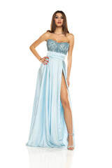 Naklejka premium Full length of gorgeous elegant sensual brunette woman wearing fashion blue evening dress isolated on white background