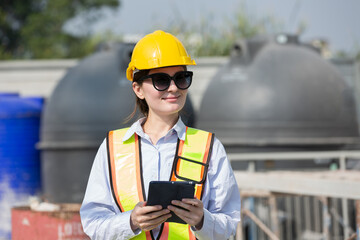 Woman builder construction at construction site. Foreman woman construction working at construction...