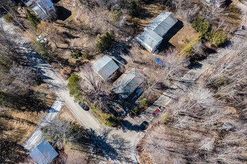 Aerial view of a quaint residential area nestled along a winding river in Tay Township, Simcoe...