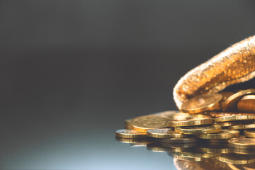Gold coins in sack. Gold money on black background. Copy space. A pile of coins .A bag with gold...