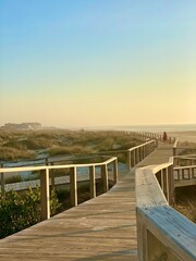 Wooden boardwalk leading to the beach. The beautiful coast of Atlantic ocean in Costa de Prata, Portugal.