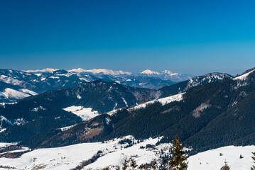 View to Mala Fatra mountains from viewpoint bellow sedlo pod Skalkou in winter Nizke Tatry...