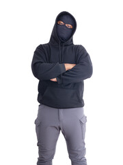 An unidentified male criminal wearing a black hoodie and covering his face stands with his arms crossed on his chest. On a white background with cliping path. Thief.weapon, crime.