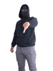 An unidentified male criminal wearing a black hoodie and covering his face stands with a thumbs up. On a white background with cliping path. Thief.weapon, crime.
