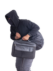 An unidentified male criminal wearing a black hoodie and covering his face, holding two large black...