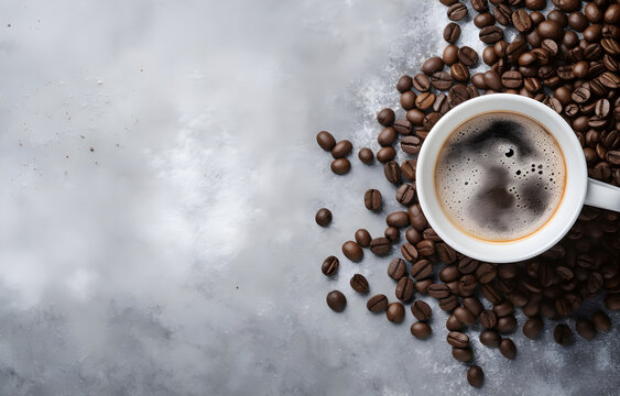 coffee cup and coffee beans on grey snowy background top view