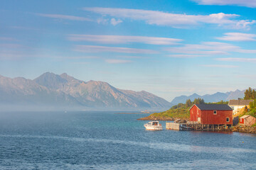 Beautiful seascape with low clouds or fog in Norway. View of the picturesque coast with the...