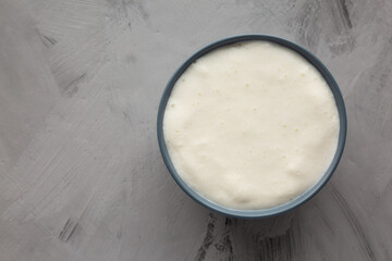 Homemade Mexican Crema Sauce in a Bowl, top view. Flat lay, overhead, from above. Copy space.