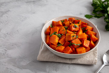 Home-baked Butternut Squash with Herbs and Spices, side view. Copy space.