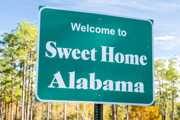 Welcome to Sweet Home Alabama - roadsign at a rest near near state line, travel concept
