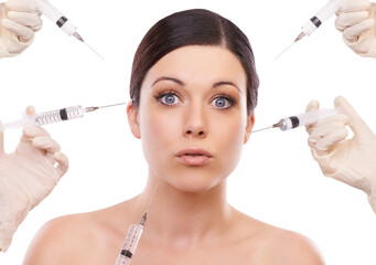 Woman, portrait and syringe for plastic surgery in shock in studio, injection and chemical by white...
