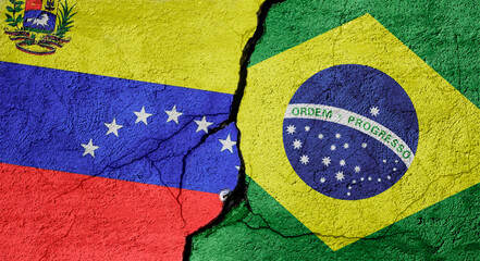 Venezuela and Brazil flags on a stone wall with a crack, illustration of the concept of a global crisis in political and economic relations