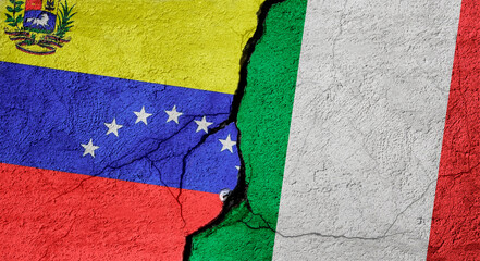 Venezuela and Italy flags on a stone wall with a crack, illustration of the concept of a global crisis in political and economic relations
