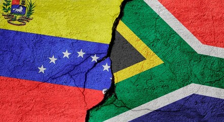 Venezuela and South Africa flags on a stone wall with a crack, illustration of the concept of a global crisis in political and economic relations