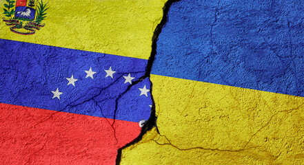 Venezuela and Ukraine flags on a stone wall with a crack, illustration of the concept of a global crisis in political and economic relations