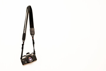 Camera hanging on isolated white background - Powered by Adobe