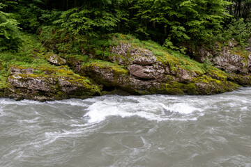 A full-flowing river, a mountainous area, a cloudy day, summer walks in the bosom of nature, a...