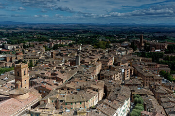 Siena. Old Medieval city in Tuscany in Italy Europe. Art and culture. Tourists from all over the world for Piazza del Campo Palio Duomo Tower del Mangia and the oldest bank banco dei Paschi 