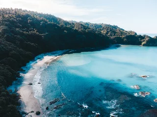 Abwaschbare Fototapete Cathedral Cove Drone photo above Ohope beach in New Zealand showing beaches, different rock formations, flora and fauna.