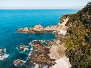  Drone photo above Ohope beach in New Zealand showing beaches, different rock formations, flora and fauna. © Sam