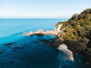 Fotobehang Drone photo above Ohope beach in New Zealand showing beaches, different rock formations, flora and fauna. © Sam