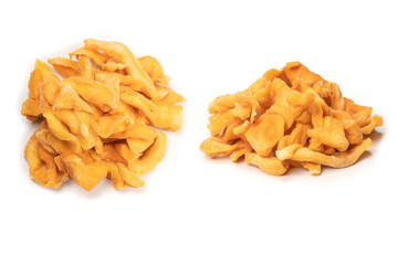 Dried melon slices isolated on a white background.
