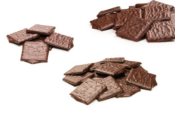 Dark chocolate candies isolated on white background.