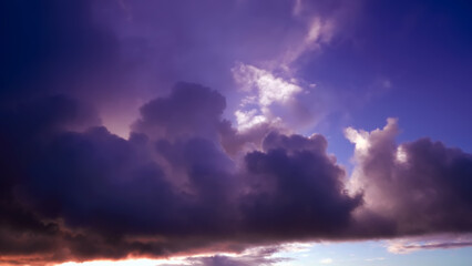 Fototapeta na wymiar Purple sky with clouds at sunset