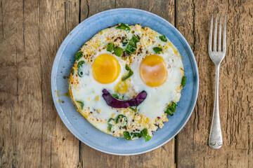 childhood breakfast with fried egg with smiley face shape